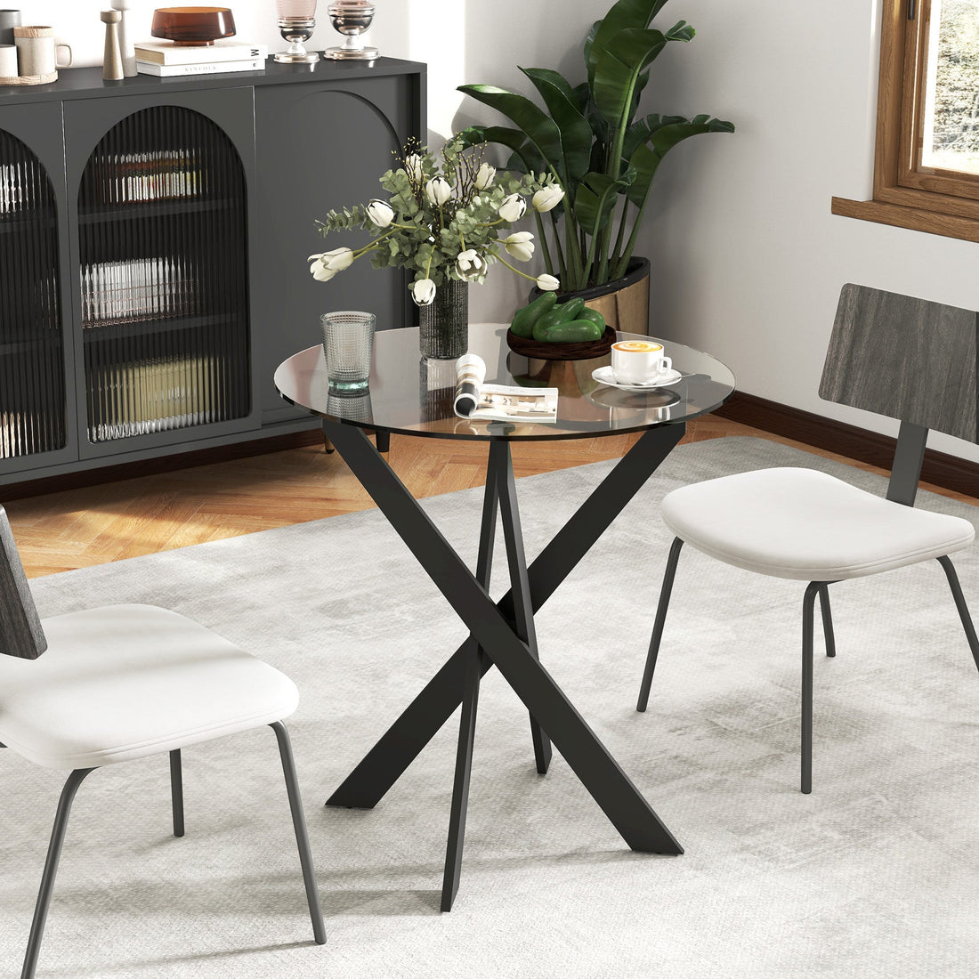 Ronde glazen eettafel met metalen poten | Kleur: Zwart, transparant | Afmetingen: 70x70x75 cm